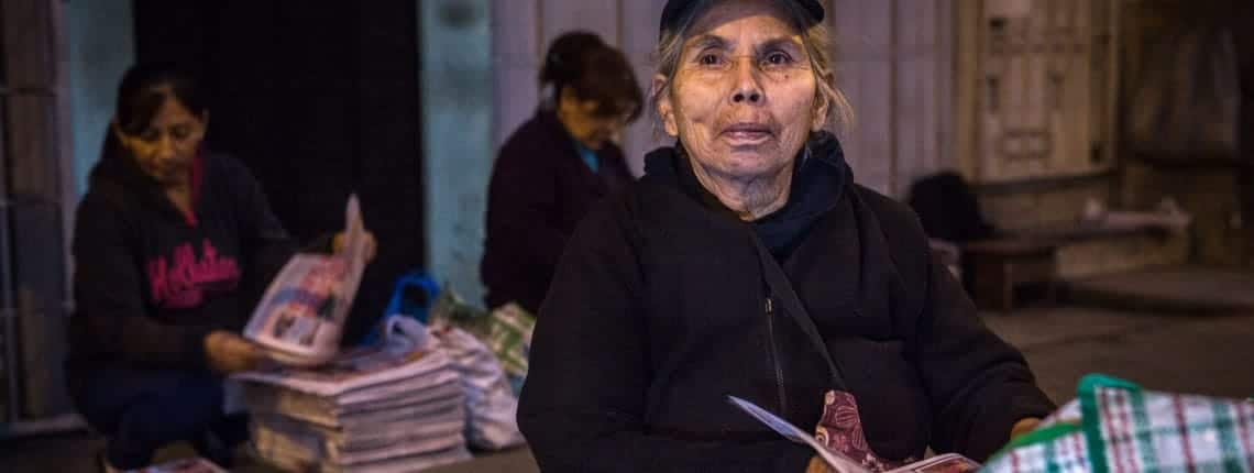 Newspaper vendor in Lima, Peru